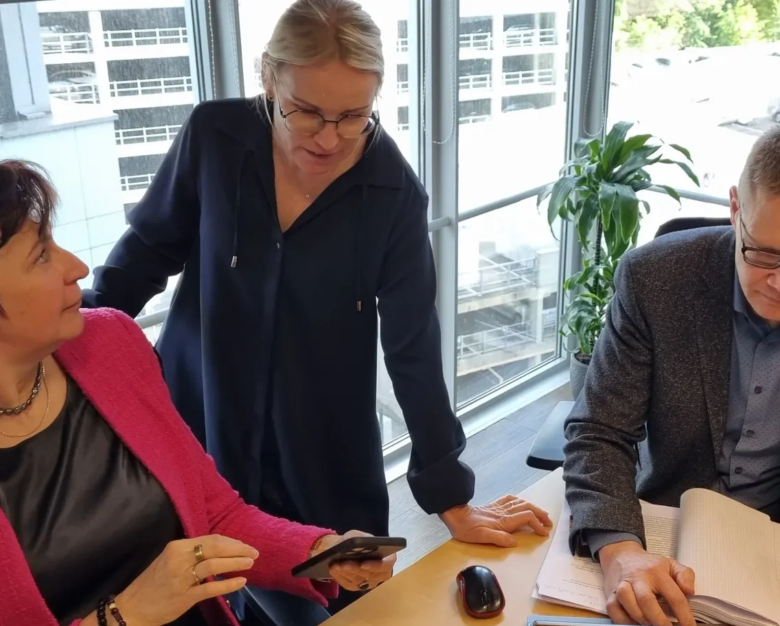 Three people working in the office